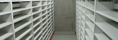 A picture of shelving stacks for storage of negative microfilms